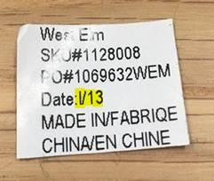 West Elm, the SKU# and the date of manufacture in Letter/YYYY format are printed on a sticker on the underside of the base.