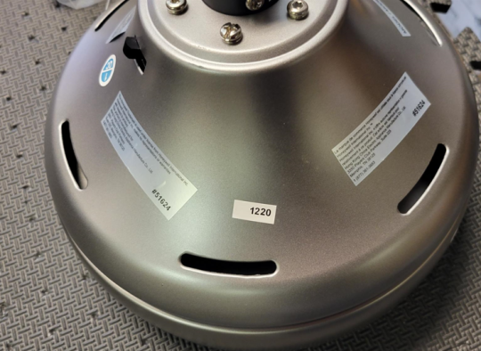 Silver rating label on fan housing assembly showing location of Model No.