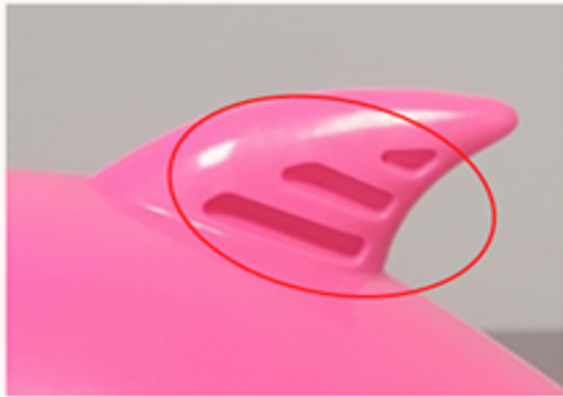 The recalled full-size toys have three grooves on one side of the hard plastic top fin