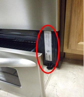 Serial plate is located by opening the range drawer at the bottom of the unit.