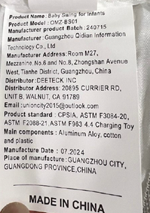 Omzer Infant Swing label located on the bottom of the seat