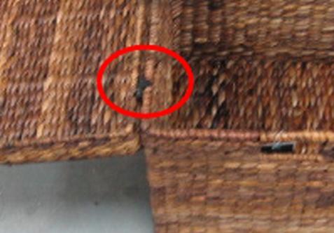 Recalled woven storage trunk showing standard hinge
