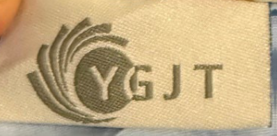 “YGJT” is printed on an attached label on the outside of the baby lounger’s cover