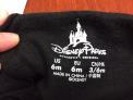 Disney Parks and the size are printed on the inside back of the hoodie’s neck