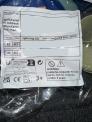 Package label identifying product name, batch code, and various warning statements