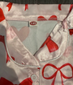 The size is printed on the sewn-in neck label of the Agddjdfjy children’s pajamas.