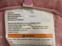 “Model Number: A001” and “Infant Baby Walker” are printed on a label on the seat’s underside.