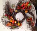 Autumn wreath with silk leaves, pumpkins and gourds