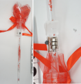 Recalled light-up heart balloon flower (Item No. 777-1) – Wand and close up showing accessible button cell batteries. 