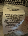 “Made in China”, and “96% polyester 4% spandex” printed on the sewn-in side seam label