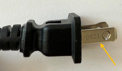 Date code etched on prong of recalled hair curling iron plug