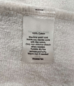 Recalled The Company Store Children’s White Robes seam label