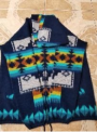 Recalled Native Creation Small Wool Sweater, blue base with multi-colored patterns