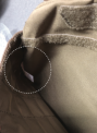 PO number and style number can be found inside the front pocket along the side seam (white dotted line).