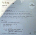Manufacturer information printed on the back of the recalled teething toy packaging