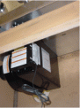 Location of label on vent fan housing, located in the cabinet under recalled cooktop