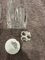The recalled shot glasses have three batteries in a compartment in the underside of the glasses