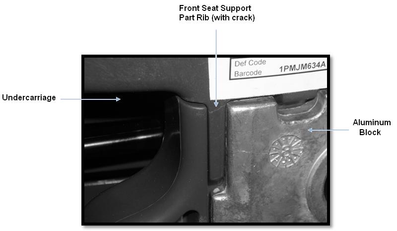Detailed view of a crack on the underside of the recalled chair