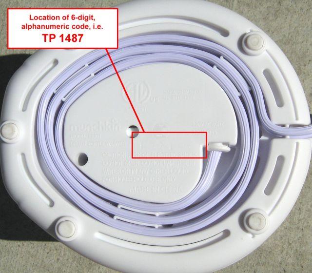Picture of the Underside of the Recalled Deluxe Bottle and Food Warmers with location of 6 digit alphanumeric code, TP 1487